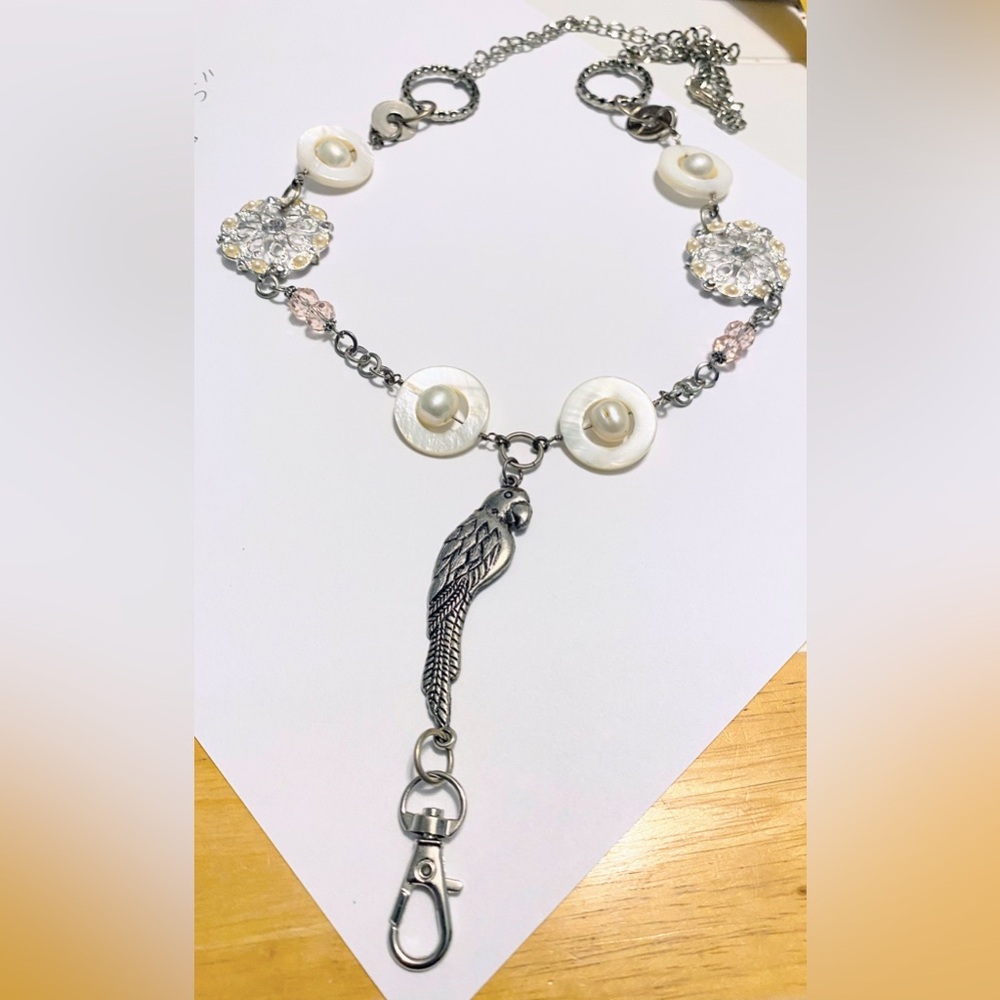 Handmade Silver Parrot Pendant Lanyard with Mother-of-Pearl and Pink Accents